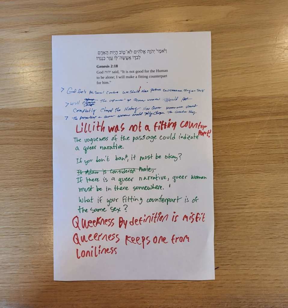 A sheet of tabloid-sized paper with a passage from the Torah printed on it, plus written commentary.